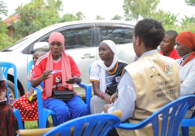 Sumaiya speaks during an outdoor community dialogue with young women and an MYCU champion