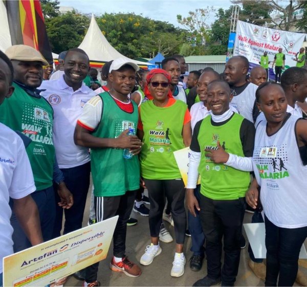 Youth champions and partners in Walk Against Malaria vests at a community walk